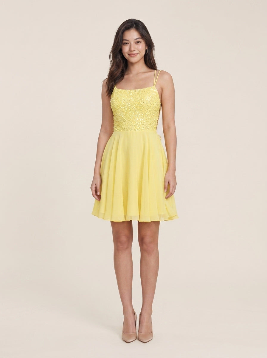 Side view of sparkling yellow A-Line homecoming dress.