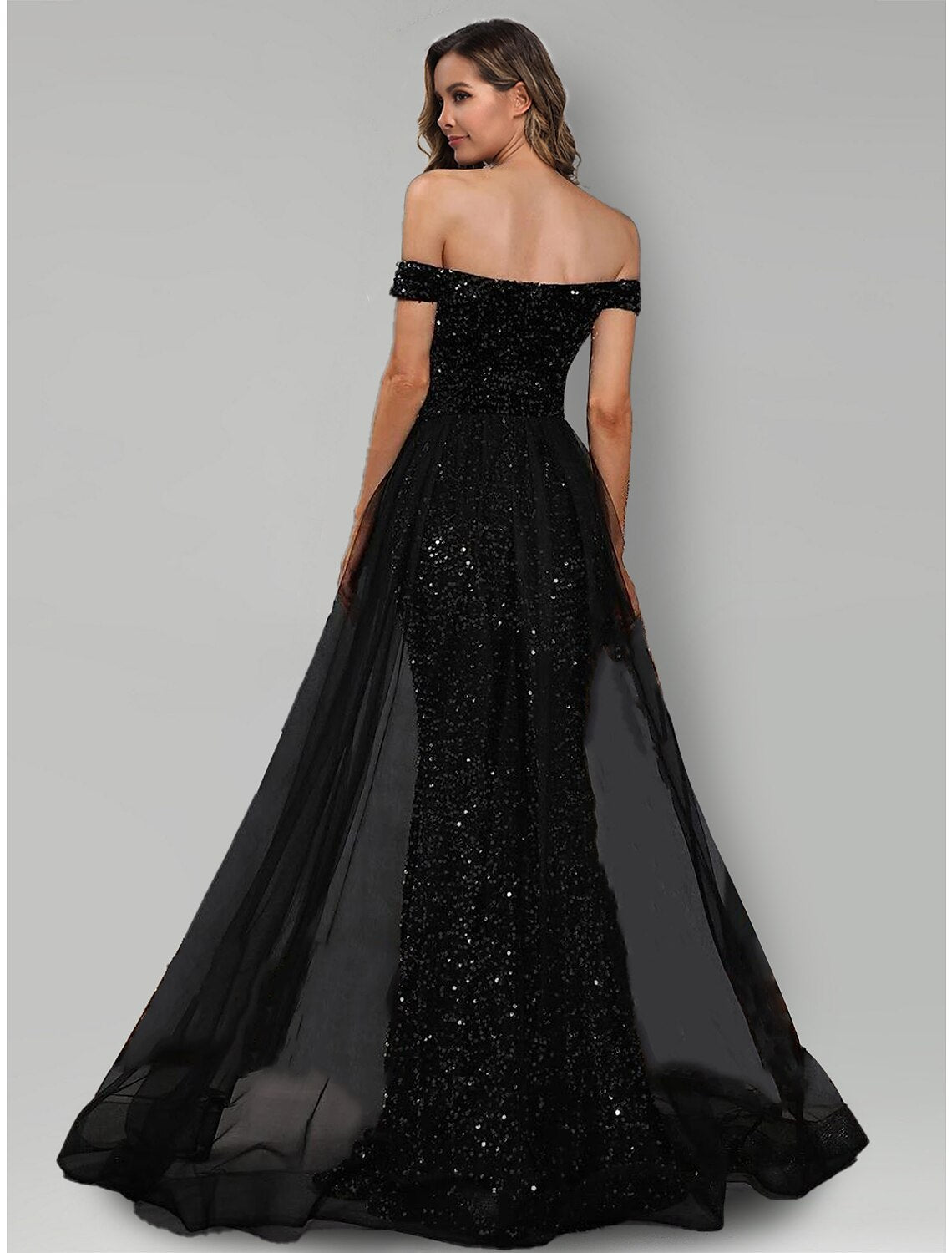 Back view of the sparkling black mermaid evening gown, showcasing the sweep train.