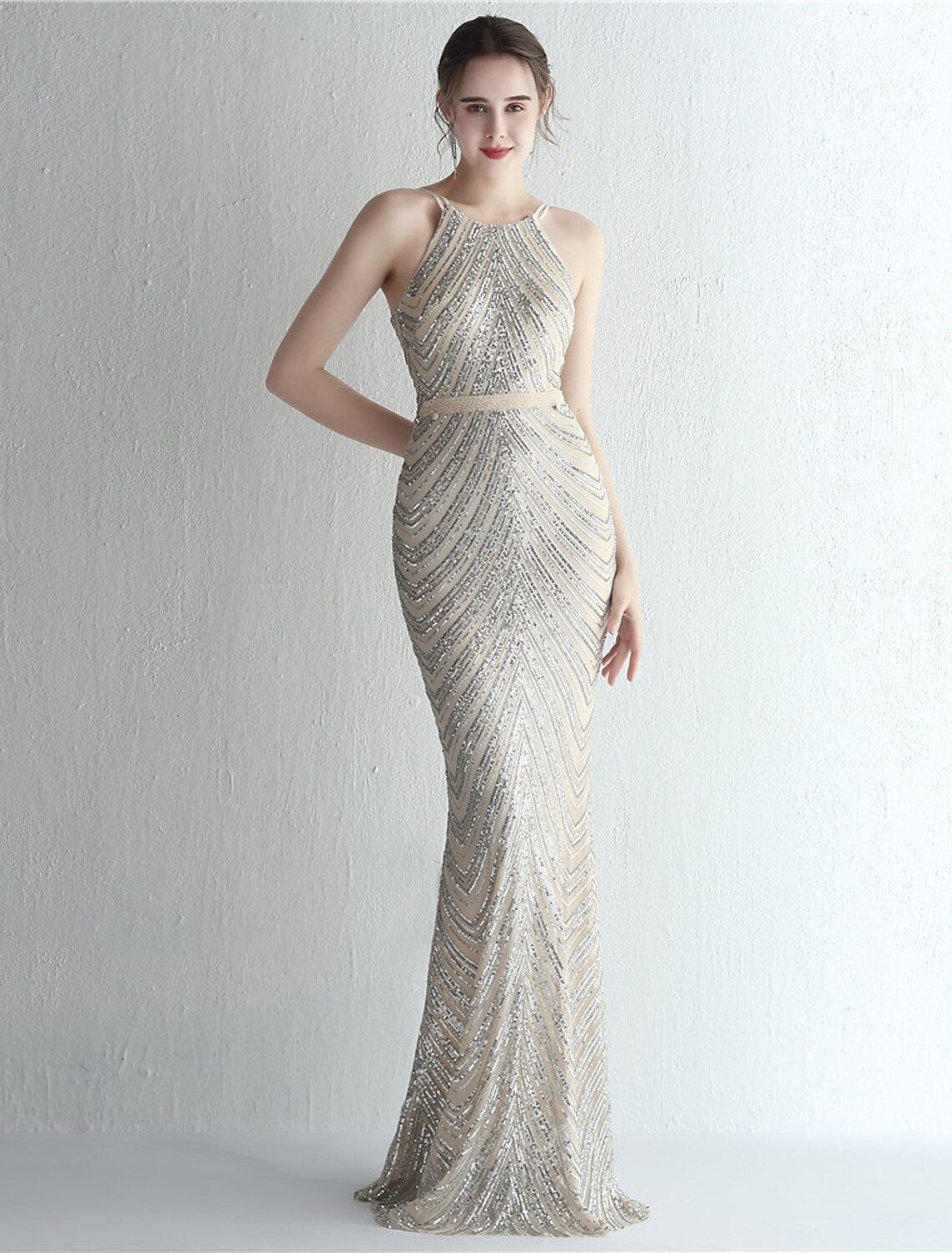 Back view of a sparkling sequin beaded mermaid prom dress.