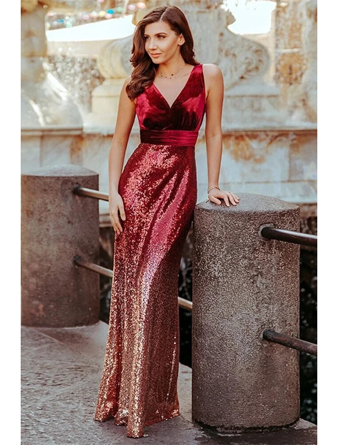 Sparkling mermaid V-neck sequined evening gown with pleats.