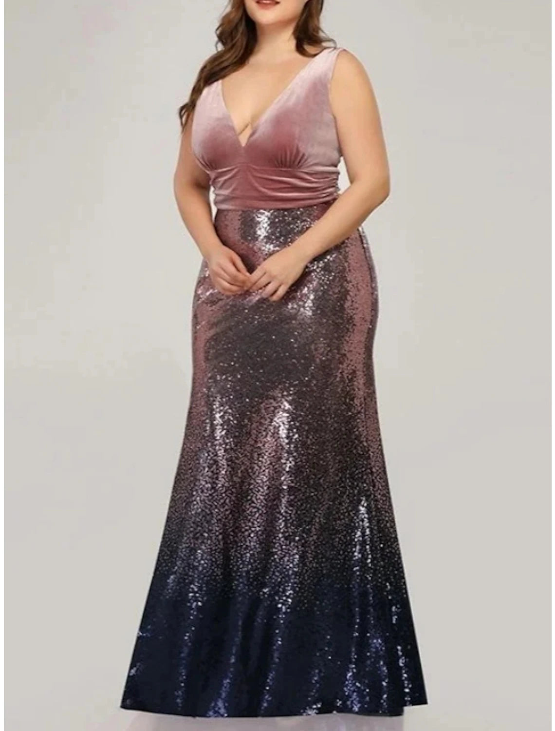 Elegant sequined mermaid gown with glitter and pleats.
