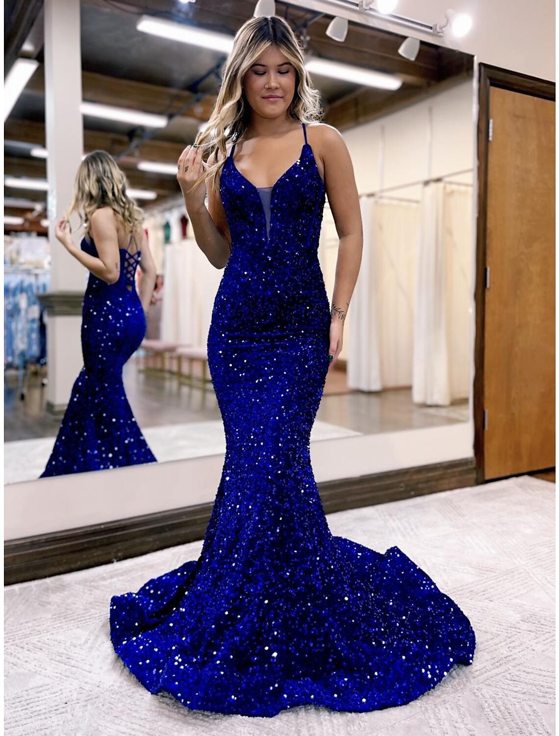 Sparkling sequined Mermaid V-neck evening gown with court train, front view.