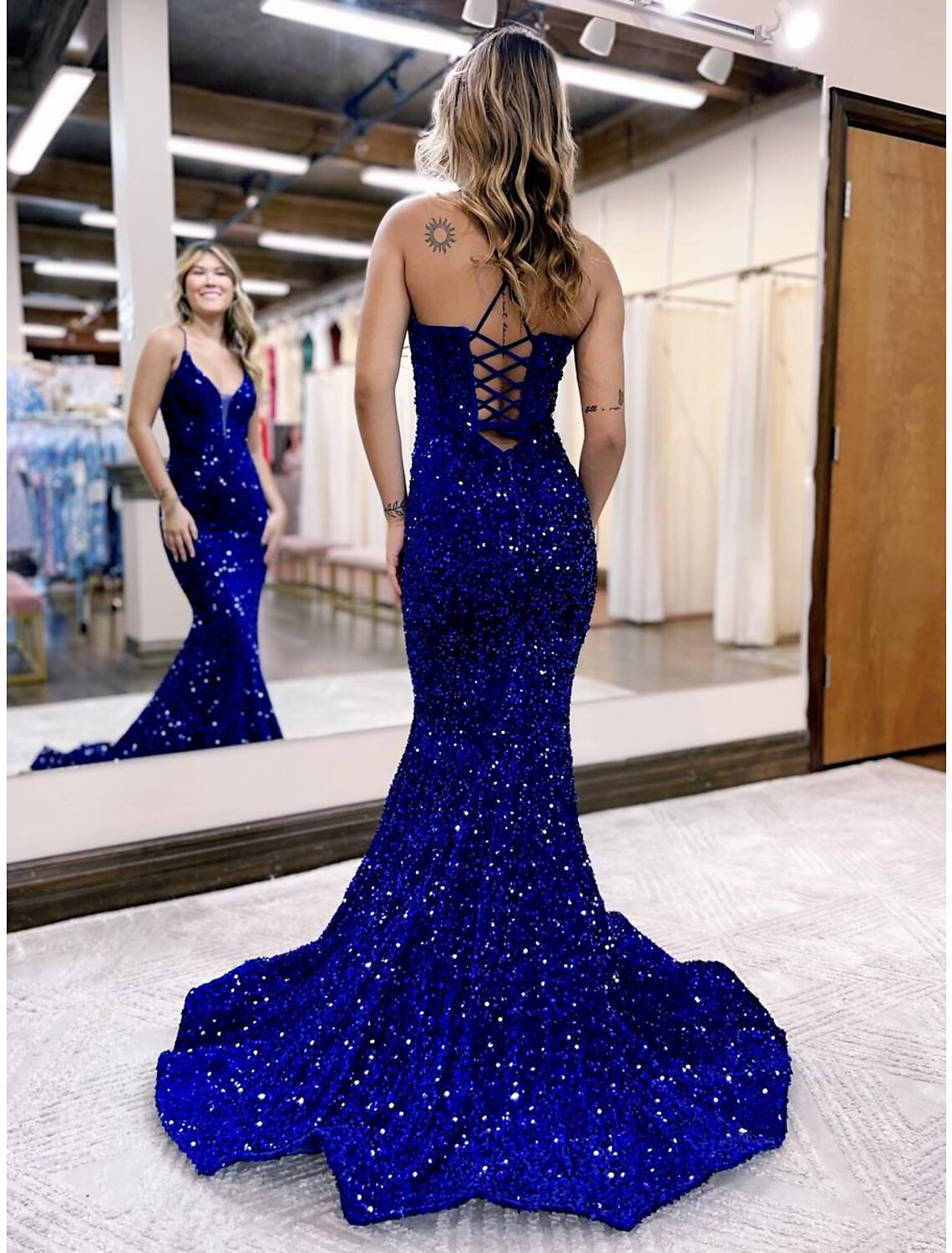 Backless sequined Mermaid evening gown with court train, side view.
