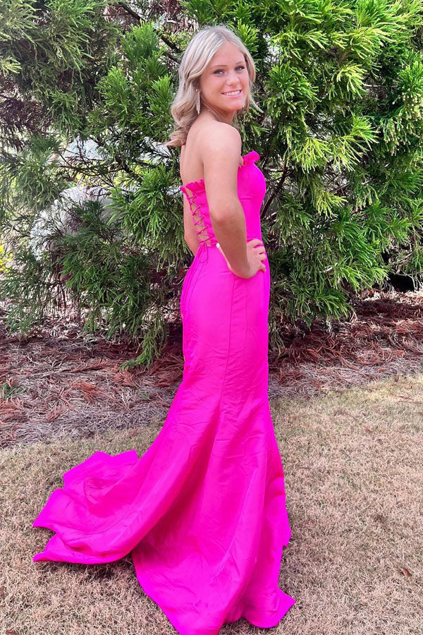 Striking strapless satin prom gown with ruffle trim, lace-up back, high slit and mermaid train