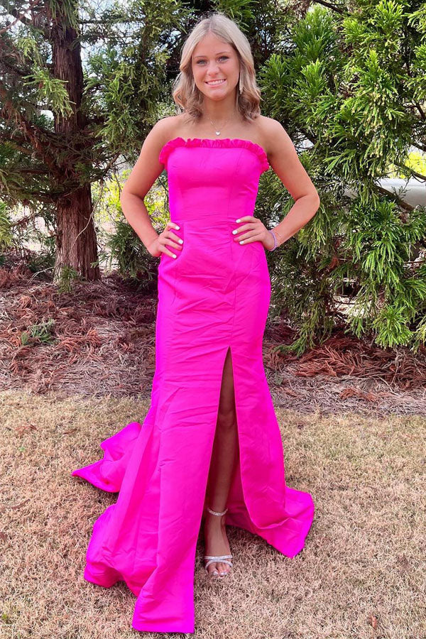 Striking strapless satin prom gown with ruffle trim, lace-up back, high slit and mermaid train