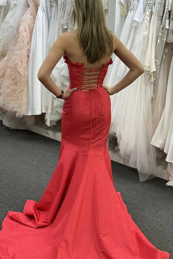 Striking strapless satin prom gown with ruffle trim, lace-up back, high slit and mermaid train