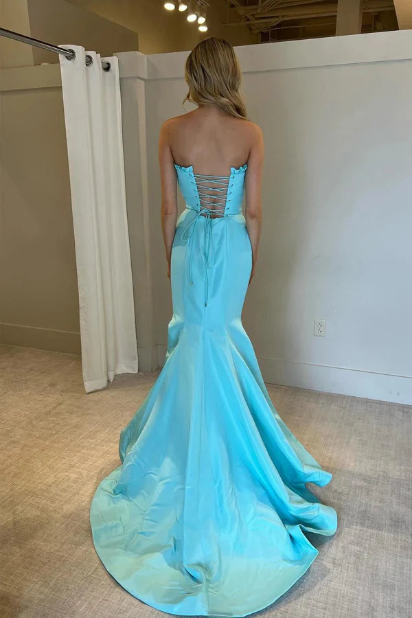 Striking strapless satin prom gown with ruffle trim, lace-up back, high slit and mermaid train