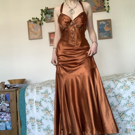 Vintage copper satin prom dress with beaded bust detail, crisscross back straps, and A-line skirt