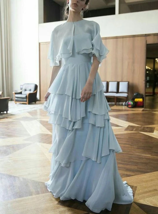Whimsical Tiered Chiffon Prom Dresses with Capelet Overlay, Keyhole Neckline, Voluminous Ruffle Skirt and Flowing Maxi Silhouette Formal Gown
