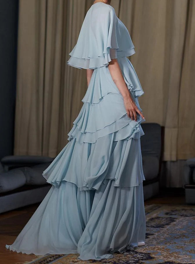 Whimsical Tiered Chiffon Prom Dresses with Capelet Overlay, Keyhole Neckline, Voluminous Ruffle Skirt and Flowing Maxi Silhouette Formal Gown