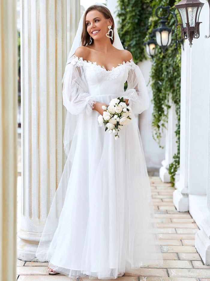 Robe de mariée transparente à manches lanternes et épaules dénudées 
