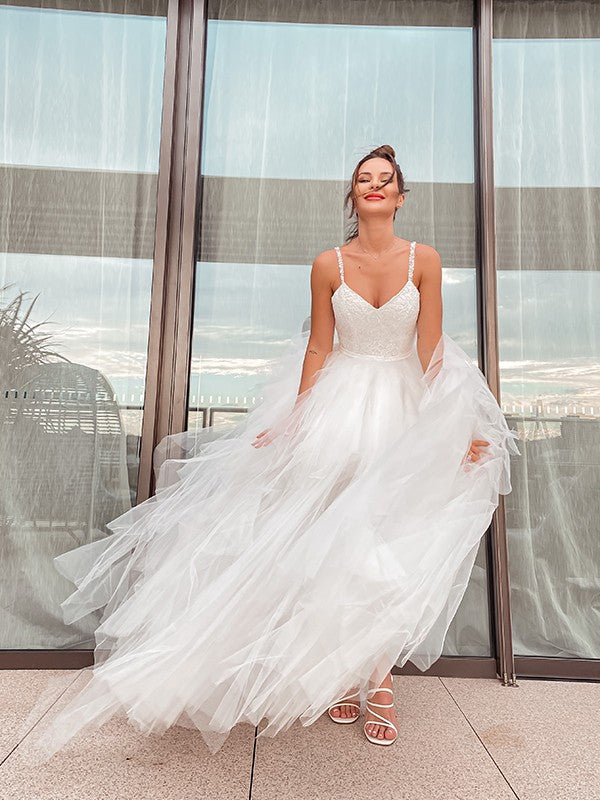 A-Line/Princess Sleeveless V-neck Tulle Ruched Floor-Length Wedding Dresses