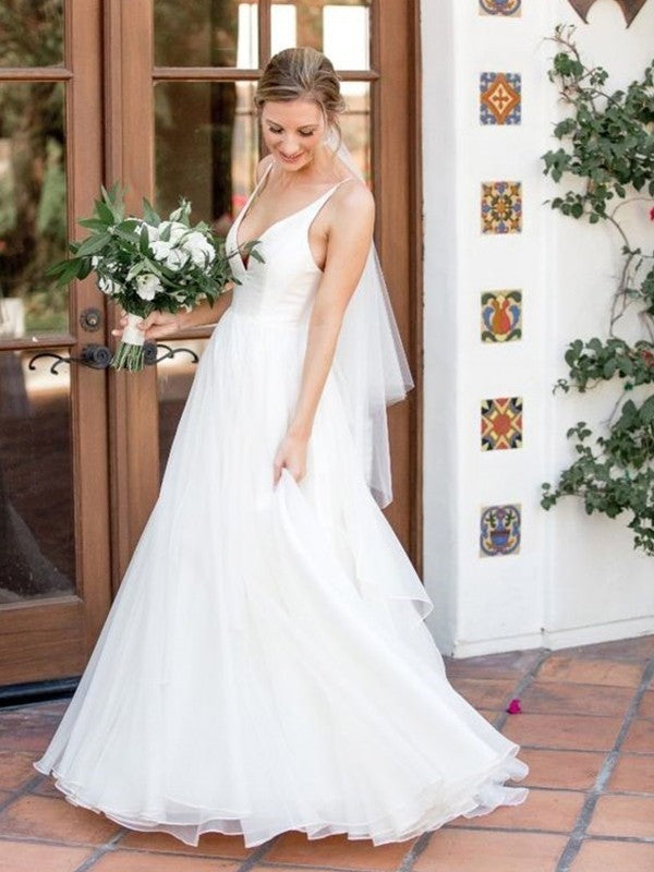 Robe de mariée trapèze/princesse en tulle, col en V, sans manches, traîne courte, volants