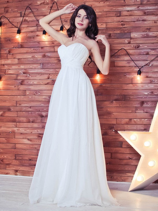 Robe de mariée trapèze/princesse en mousseline de soie, à volants, décolleté en cœur, sans manches, longueur au sol