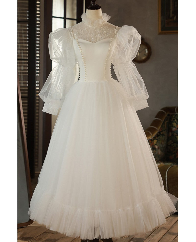 Robe de mariée élégante en ivoire avec perles, col haut, manches 3/4, en forme de A, finement brodée, dos nu, longue