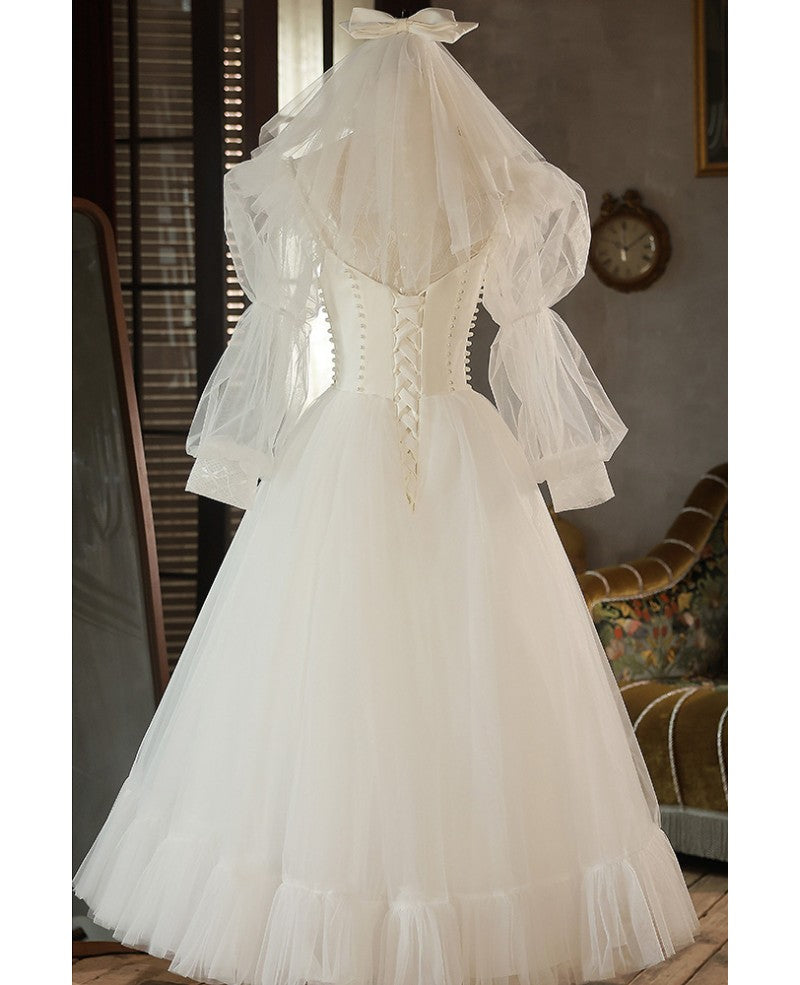 Robe de mariée élégante en ivoire avec perles, col haut, manches 3/4, en forme de A, finement brodée, dos nu, longue