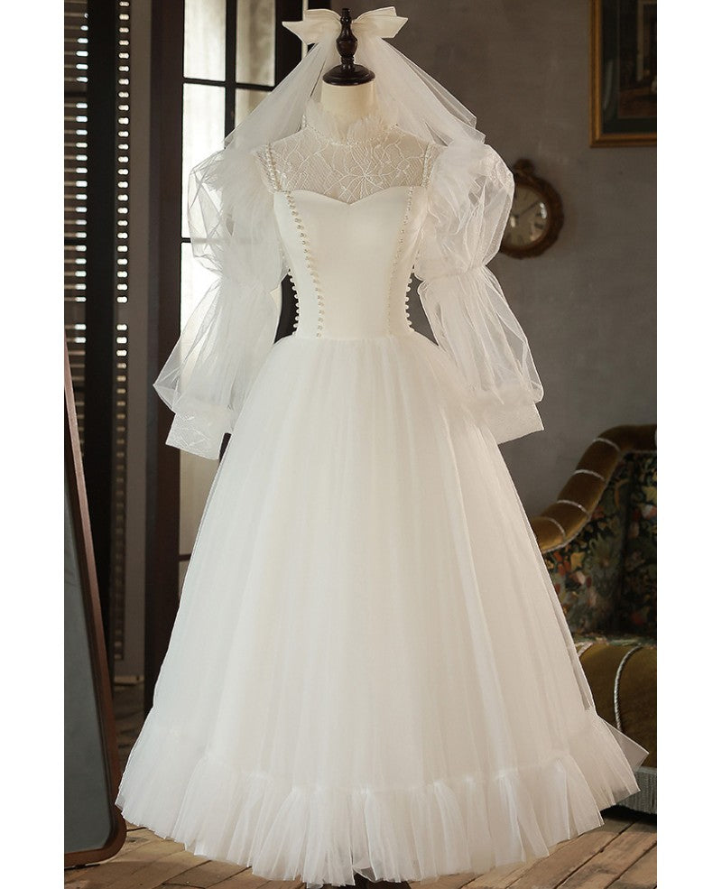 Robe de mariée élégante en ivoire avec perles, col haut, manches 3/4, en forme de A, finement brodée, dos nu, longue