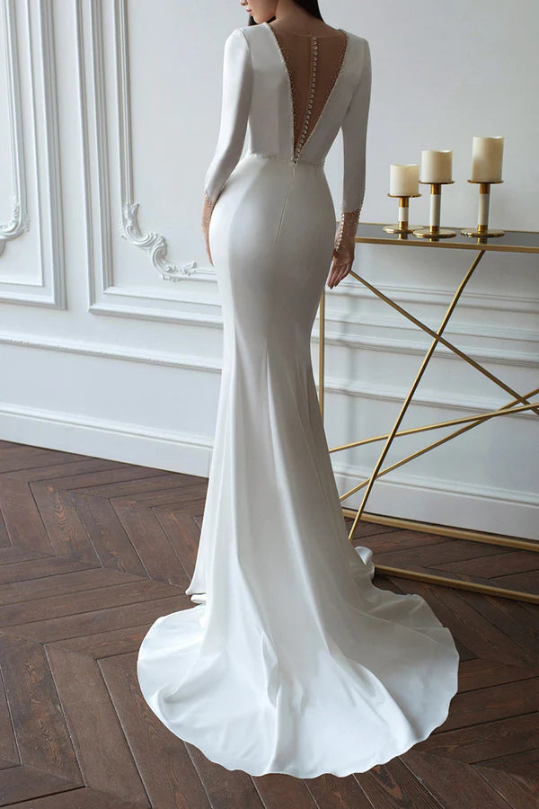 Robe de mariée en satin à manches longues et décolleté en V profond avec effet fourreau/pilier