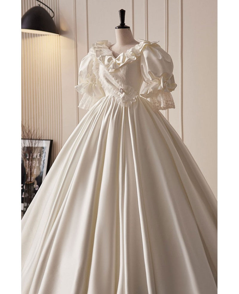 Vintage ivory pearl rhinestone bow short sleeved wedding dress ivory satin ruffled V-neck backless and ground length wedding dress
